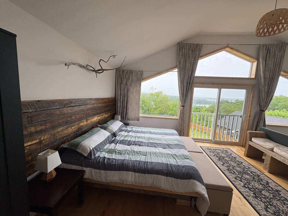 Primary bedroom with harbour view