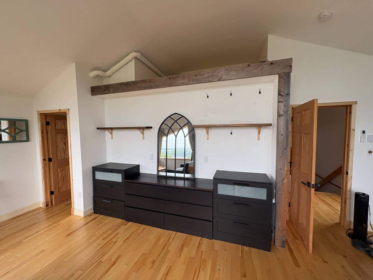 Primary bedroom storage and handmade wood detail