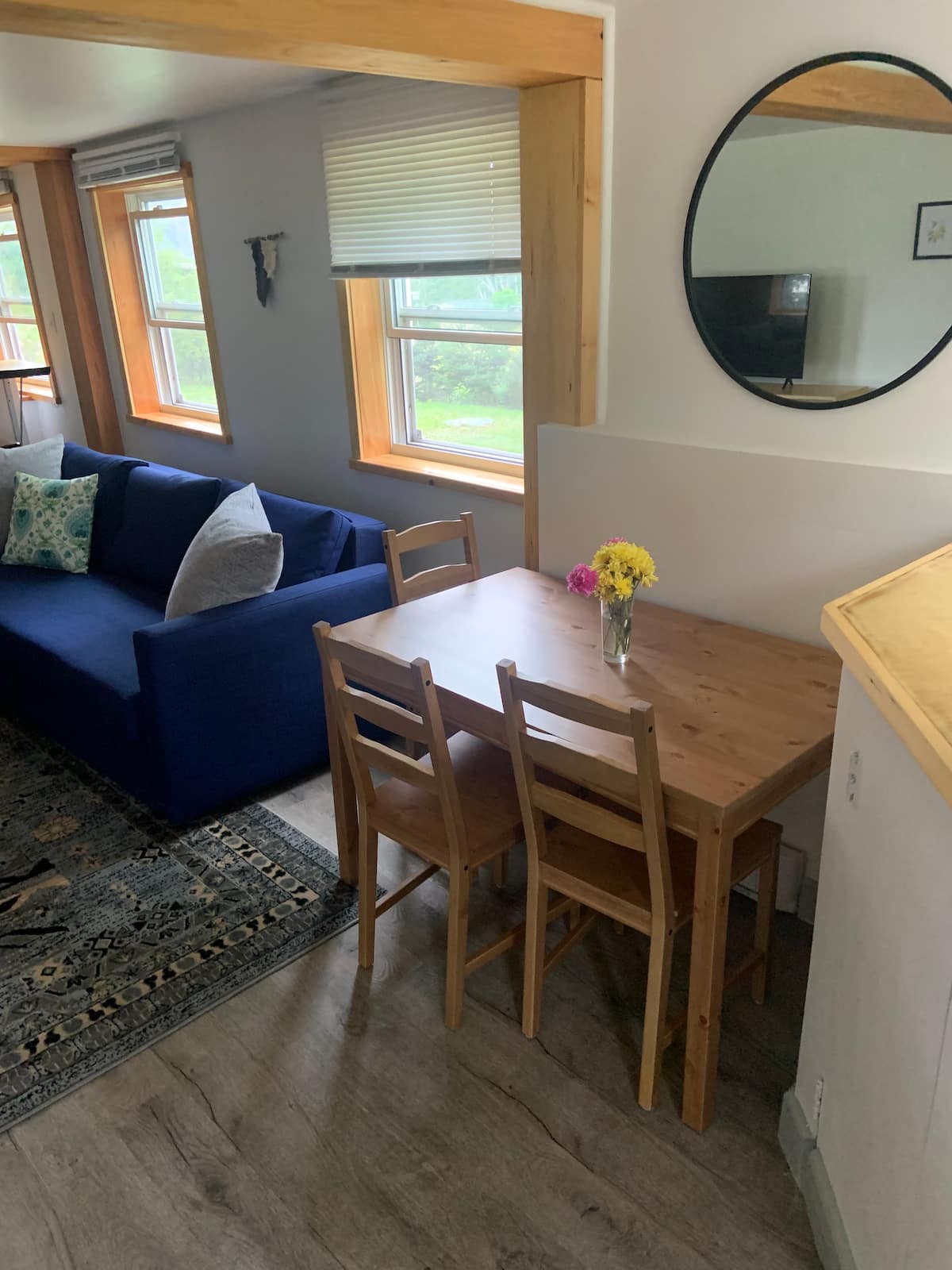 Lower-level living room sofa and dining nook