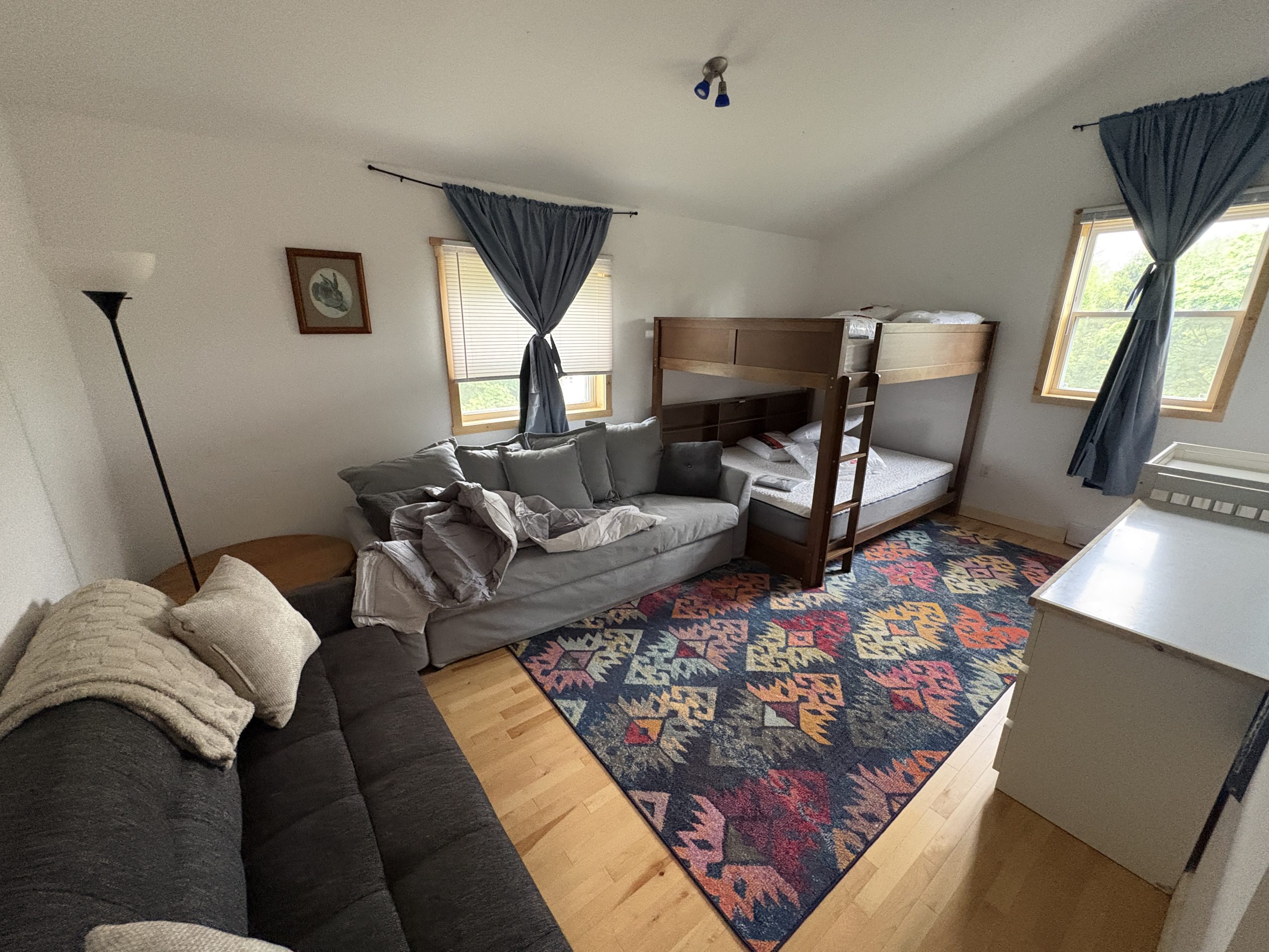 Upstairs flexible room detail with bed and window